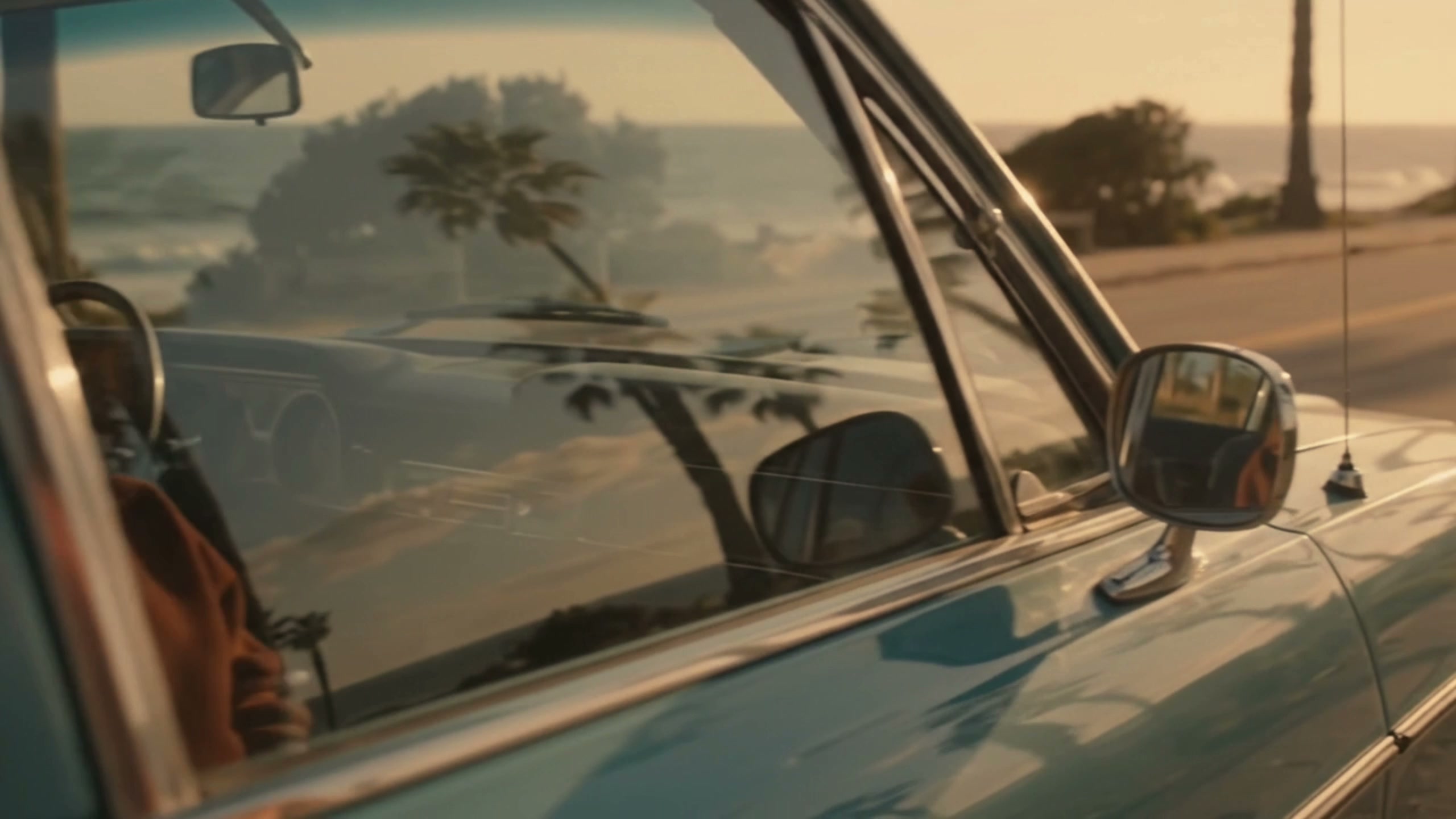 Vintage coastal car reflecting the ocean light